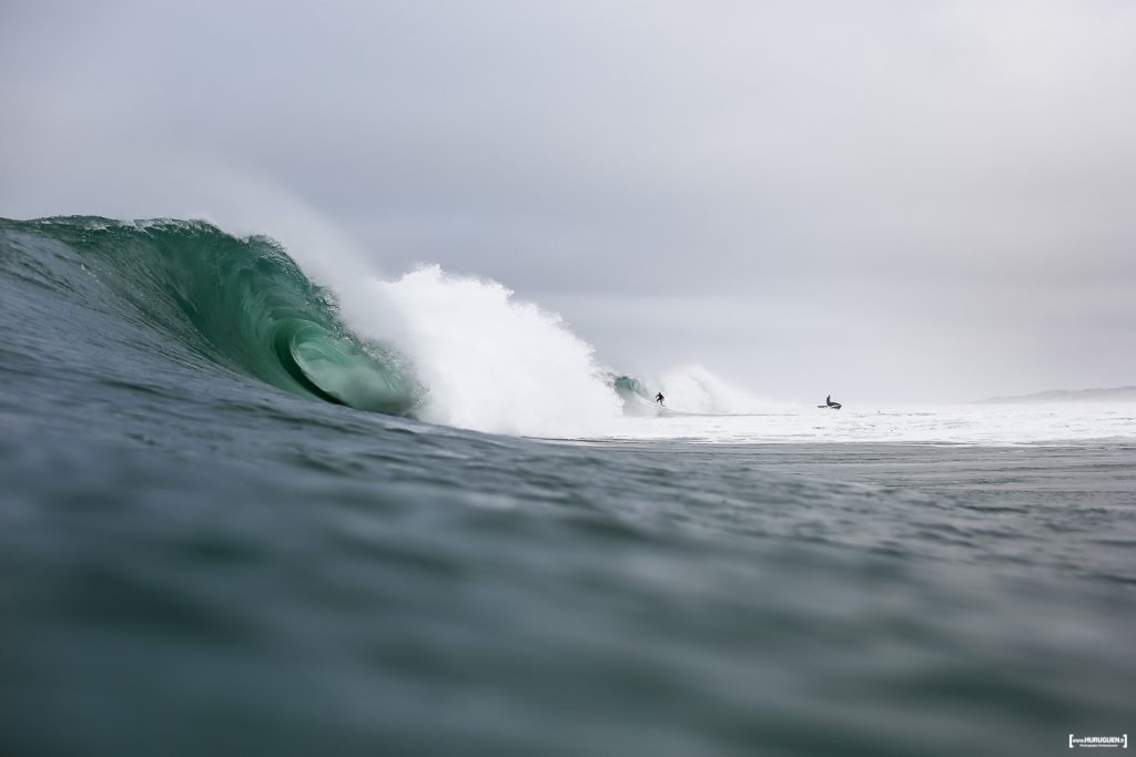 French surfer Nicolas Brieda getting out of a long tube ride with his team mate the photographer Bastien Bonnarme in Hossegor at the Quiksilver Pro France 2016 contest site this morning at the culs nus beach