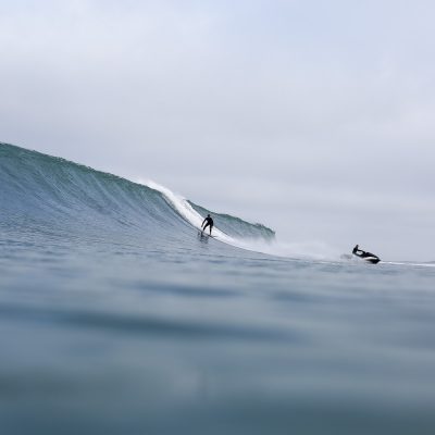 Bastien Bonnarme placing Nicolas Brieda stepping off the jet ski on a set wave at the culs nus beach in Hossegor - Quik Pro France 2016 | Sebastien Huruguen www.huruguen.fr